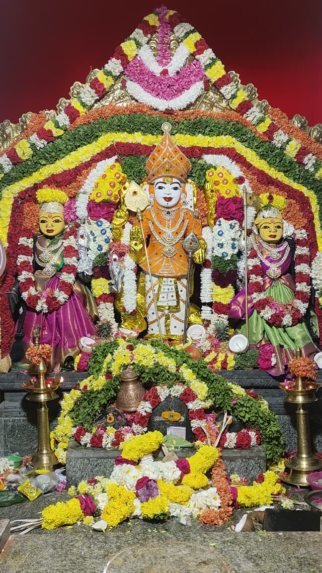 Lord Murugan adorned with garlands at Ponmalai Sri Murugan Temple